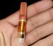 A high potency 5-MeO-DMT vape pen resting on a dark surface, representing where to buy high potency 5-MeO-DMT vape pens in Toronto.